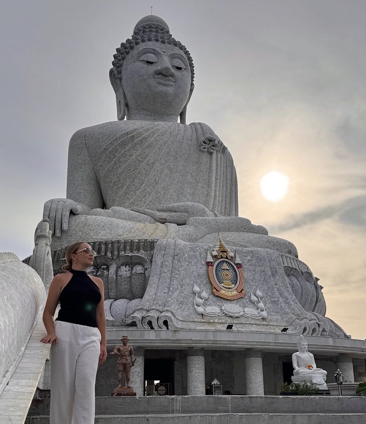 Visitor in modest respectful clothing at the temple complex at the top of Nakkerd Hill Phuket